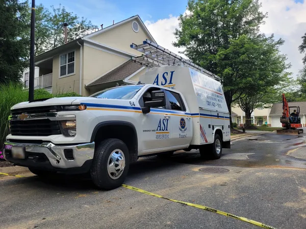 ASI construction crew and equipment on a job site